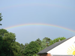 A beautiful faint double rainbow, right in my backyard.